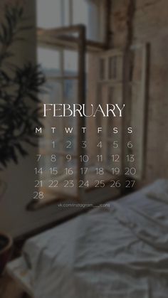 a bed with white sheets and pillows in front of a window that has a calendar on it