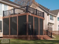 a house with a deck and screened in area