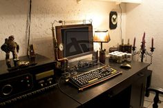 a desk with a computer, lamp and other items on it in a home office