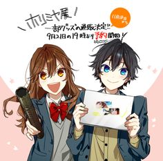 two anime characters are holding an item in front of their faces and looking at the screen