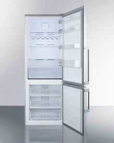 an empty refrigerator with its door open on a shiny surface in front of a white wall