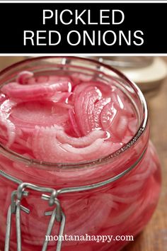 pickled red onions in a jar with text overlay that reads pickled red onions