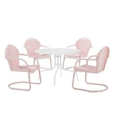 three pink chairs and a white table