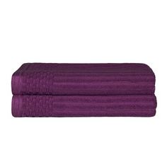 the purple towels are stacked on top of each other