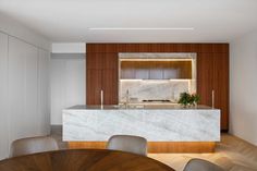 A contemporary kitchen with a large island, wood cabinets, and LED lighting. Oak Floorboards, Function Room, Kitchen Marble