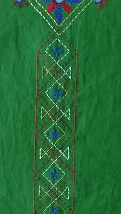 a green piece of cloth with birds and flowers on it, in the shape of a tower