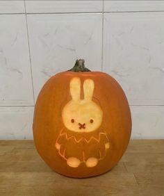 a carved pumpkin with an image of a rabbit on it