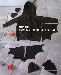 an image of a bat cut out on the floor with scissors and fabric to make it look like they're cutting