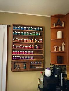 a coffee bar with lots of bottles on the shelves