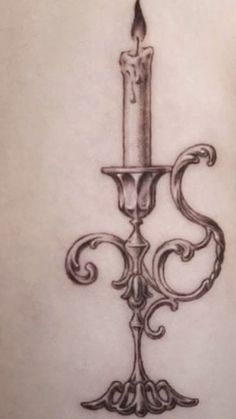 a tattoo with a candle on it