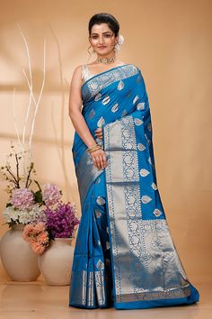 Elevate your ethnic wardrobe with this Exquisite Handwoven Banarasi Saree, a masterpiece of traditional Indian craftsmanship. Made from premium quality silk, this saree features intricate Zari work that showcases the rich cultural heritage of Banaras. Perfect for weddings, festivals, and special occasions, this Banarasi saree exudes elegance and sophistication. Each saree is meticulously handcrafted by skilled artisans, ensuring that every piece is unique and of the highest quality. The luxuriou Traditional Wear With Zari Weaving For Puja And Eid, Traditional Wear With Zari Weaving For Puja During Eid, Eid Traditional Wear With Zari Weaving For Puja, Eid Puja Traditional Wear With Zari Weaving, Festival Traditional Wear In Art Silk With Zari Weaving, Traditional Wear For Diwali With Zari Weaving, Eid Art Silk Pre-draped Saree, Zari Weaving Saree For Diwali Ceremonies, Traditional Wear With Pallu For Diwali