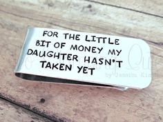 a silver money clip that says for the little bit of money my daughter hasn't taken yet