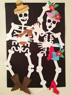 paper cut out of skeletons with hats and boots