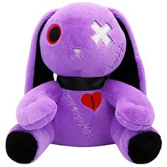 a purple stuffed animal with a cross on it's chest