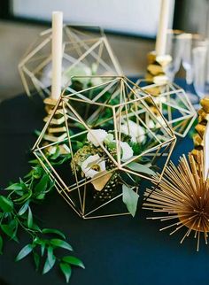 the table is set with candles, flowers and other things to decorate it for someone's special occasion