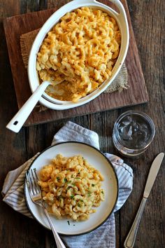 a bowl of macaroni and cheese on a wooden table