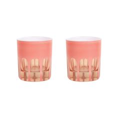 two pink glass cups sitting next to each other