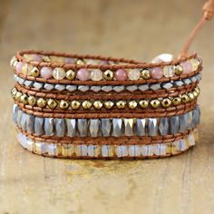 This exquisite wrap bracelet is crafted with luxurious labradorite, jasper, crystal, and pyrite stones and is sure to give your look a touch of bohemian chic. The stackable design creates a layered effect that adds texture and an eye-catching shimmer for a stunning, sophisticated accessory that will bring a hint of glamour to any ensemble. *Material: Jasper, labradorite, crystal, pyrite, leather *Making Technics: Handmade Sewed *Size: 32.5 inches, 3 closures adjust length to fit your wrist. *Pro