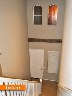 an empty hallway with white doors and windows