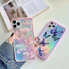 two phone cases with butterflies on them, one is pink and the other is blue