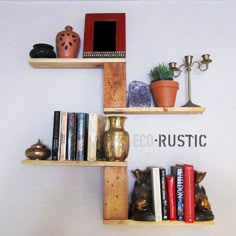 three wooden shelves with books, vases and other decorative items on top of them