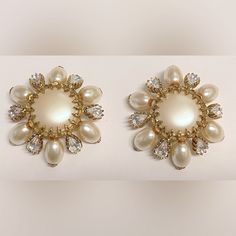 two pairs of pearl and crystal earrings on white background with clippings to the side