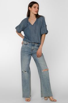 The Kenna Blouse offers an elegant style with its smocked neck, pleated elbow puff sleeve, and V-neck. It's perfect for dressier occasions, while still remaining comfortable and easy to wear. Material: 100% Tencel™ Eco-Friendly Color: 405 Malibu Machine wash cold or hand wash Model is 5'9" and wearing a size S Imported Malibu Blue, New Tops, Cami Tanks, Blue Blouse, Jacket Sale, Skirt Pants, Jacket Outfits, Elegant Style, Sweater Jacket