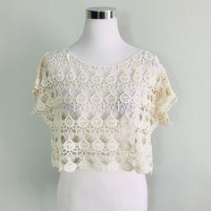 Short Sleeve Top Features A Scoop Neckline, Crochet Material, Boxy Fit And Scalloped Hem. (Undershirt Not Included) Fabric Content: 100% Cotton Size Scale: S/M - M/L Description: L: 14" B: " W: 21". Firm Price Beige Crochet Lace Crew Neck Top, Beige Crochet Summer Tops, Summer Beige Crochet Tops, Beige Crew Neck Crop Top For Summer, Summer Crochet Top With Crochet Trim, Summer Lace Tops With Open Knit, Summer Crochet Trim Short Sleeve Top, Summer Lace Top With Open Knit, Cream Lace Top With Open Knit