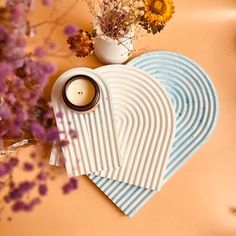 a table topped with plates and cups filled with flowers