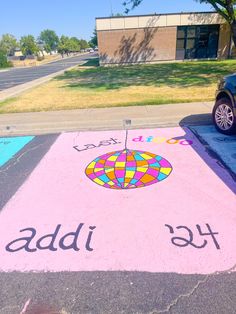 a car parked in front of a parking lot with the word add written on it