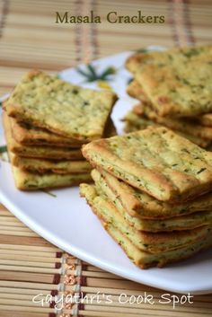 some crackers are stacked on a white plate