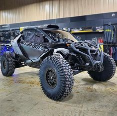 a large four - wheeled vehicle parked in a garage