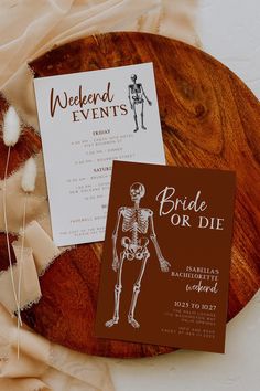 a wooden plate with a card and skeleton on it