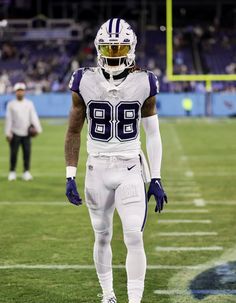 a football player is standing on the field