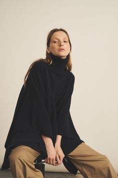 The Angela cashmere poncho has a great sentimental value for Linnea Lund : it has been conceived in honour of our founder’s sister and her infinite quest for elegance, comfort and warmth. With a cashmere so soft that easily compares to a warm embrace, this poncho has become a must-have for those who want to feel as if they were bundled up in a cocoon of softness.Charlotte’s fashion tip: “This poncho is a must-have in the Swedish wardrobe. It is perfect to wear outdoors as well as at home with a Cozy Oversized Cashmere Poncho, Oversized Cozy Black Poncho, Winter Blue Knit Poncho, Turtle Neck Collar, Oversized Long Sleeve Cashmere Poncho, Luxury Wool Poncho, One Size, Loungewear Outfit, Raw Denim Jeans, Collar Scarf