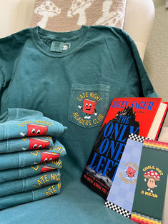 Unwind in style with the Late Night Readers tshirt. Featuring Norman the Novel and the phrase 'late night readers club', this emerald green comfort colors pocket tee evokes retro vibes and bookish charm.(Cue the urge to curl up with a good book.)
Snag a matching bookmark set to match your tee!

Available in sizes small to 3x Comfort Colors Tshirt, Pocket Tshirt, Branded Shirts, Pocket Tee, Retro Vibe, Late Night, Sizing Chart, Comfort Colors, Emerald Green