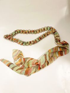 "Vintage Scarf Chain Belt Retro Belt Vtg 1990s Multi-color Scarf Tie Closure Silver Chain-link  Funky Belt Mod Ladies Accessories Super Cute! Colors of green, orange, brown woven into round silver-tone metal circles. Check out the shop for more belts to add to your collection.  Condition: Good Vintage Condition Measurements:    37\" length of chain link   20\" scarf extension   1\" width of chain link Preloved/Preowned; Some signs of use and wear ------------------------------------------------- Hippie Belt, Scarf Tie, Ladies Accessories, Scarf Belt, Scarf Tying, Bohemian Hippie, Chain Belt, Vintage Scarf, Hippie Bohemian