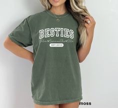 Comfort Colors, Besties Shirt, Best Friend Shirts, Matching Best Friends shirt, Sisters Shirts, Bestie Best Friends Shirts, Gift for Besties ❤ Comfort Colors Brand ❤ Unisex Adult Sizing ❤ 100% Cotton ❤ DTG (Direct To Garment) printing, which means the ink is directly printed into the fabric Additionally, since all items are custom made to order, we do not accept returns or exchanges. Please carefully review the sizing details provided, as our t-shirts are unisex and not specifically tailored for women. For a slimmer fit, ladies should consider ordering one size down. Many designs in our shop can be customized, but additional costs may apply depending on the specific custom request. To place an order, please follow these steps: 1. Select the desired size and color of the shirt from the drop Relaxed Fit Fan Apparel Shirt, College Graphic Print Relaxed Fit Shirt, Green Custom Print Top For Fan Merchandise, Pre-shrunk Relaxed Fit Fan Apparel Shirt, Relaxed Fit Pre-shrunk Fan Apparel Shirt, Relaxed Fit Band Merch Shirt, Green Cotton Band Merch Top, Best Friend Matching Shirts Funny, Besties T Shirts