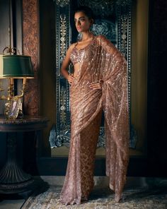 This coffee brown net saree features tonal sequin and crystal embroidery in an abstract geometric pattern. The matching halter cut blouse is full embroidered.From Seema Gujral's Kashish collection DELIVERY TIMEPlease allow 8-12 weeks for your outfit to arrive. FABRIC DETAILSNet Professional cleaning only. Brown Net Saree, Seema Gujral, Sequin Saree, Cut Blouse, Crystal Embroidery, Backless Blouse, Net Saree, Beautiful Dresses For Women, Abstract Geometric Pattern