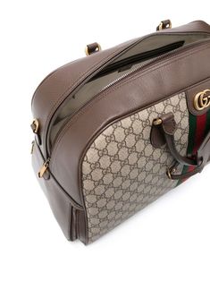 large Gucci Savoy duffle bag from Gucci featuring brown, GG Supreme canvas, leather trim, gold-tone hardware, signature Interlocking G logo, signature Web-stripe trim, metal feet, top zip fastening, padlock detail, adjustable detachable shoulder strap and two rolled top handles. This item is in size UNI and the color is Luxury Duffle Bag Tote With Zipper Closure, Gucci Monogram Canvas Bag With Zipper, Gucci Travel Tote Satchel, Gucci Tote Satchel For Travel, Designer Satchel Weekender Bag, Luxury Top Handle Duffle Bag With Zipper Closure, Brown Gucci Satchel For Travel, Gucci Travel Bags With Gold-tone Hardware, Gucci Luxury Bags With Zipper Closure