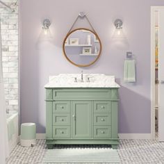 a bathroom with purple walls and white fixtures