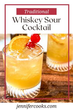 the traditional whiskey sour cocktail with orange slices and garnish