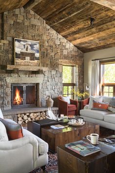 a living room filled with furniture and a fire place