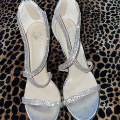 Windsor Size 8 (Brand New / Never Worn) Women’s Silver Strapy Heels With Rhinestones On The Front With One Strap Across The Toes And Crisscross On The Front Of The Ankle. The Back Is Closed With A Silver Zipper. Perfect Condition. Never Worn. Perfect For Any Party/ Wedding! Still Have Box, Never Worn. Sparkle High Heels, Heels With Rhinestones, Silver Rhinestone Heels, Gold Platform Heels, Tan High Heels, Silver Sparkly Heels, Strapy Heels, Formal Heels, Sparkle Heels