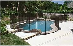 a pool fenced off in to a backyard