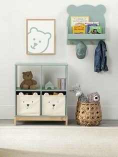 a child's room with teddy bears, bookshelves and other toy items