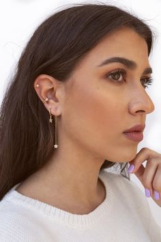 The Mikayla are single band conch ear cuff earrings with a star and pave cubic zirconias. These minimalist, modern, dainty earrings can be worn daily as well as on special occasions. Perfect for a gift! Features: * No piercing hole needed. * Inner diameter: 9 mm. * Star size: 5 mm. * They are sold in singles and in pairs. Both options are available on the dropdown menu. * All of our jewelry is made of sterling silver (925 mm), and our gold jewelry is gold plated in 18K gold. Nickel free. Packagi Cubic Zirconia Dangle Ear Cuff, Everyday Star Cartilage Earrings, Adjustable Hoop Earrings With Star Charm, Star Rain, Moon Studs, Minimalist Studs, Ear Cuff Earings, Snake Design, Tiny Stud Earrings