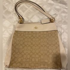 Authentic Coach Brand New Never Used With Tag Still Excellent Condition Shipping Only Bag, No Dustbag Sorry * Listing A Little Higher Than The Tag Price Just Cause Poshmark Takes Out A Percentage Elegant Coated Canvas Bucket Bag For Errands, Designer Beige Shoulder Bag With Removable Pouch, Coach Cream Hobo Shoulder Bag, Cream Bucket Bags With Gold-tone Hardware, Beige Coated Canvas Shoulder Bucket Bag, Beige Coated Canvas Bucket Bag, Designer Beige Hobo Bag With Detachable Handle, Luxury Beige Hobo Bag With Removable Pouch, Coated Canvas Shoulder Bag For Errands