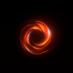 an orange swirl is shown in the dark