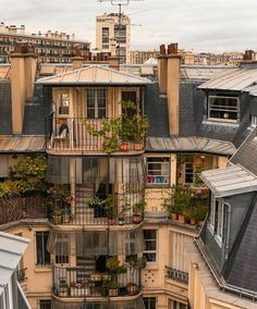 an apartment building with lots of windows and balconies on the top floor is seen from above